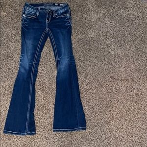 Dark-blue kids MissMe jeans.